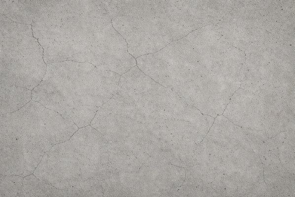 Graue Textur mit feinen Rissen und unregelmäßigen Mustern.